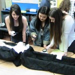 students examining body