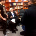students interacting with dog