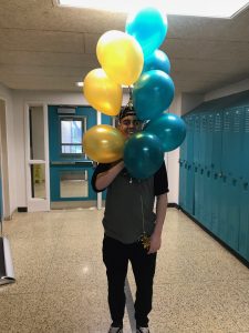 seb holding balloons