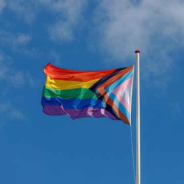 pride flag over a blue sky